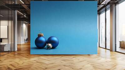 Blue vintage Christmas baubles on a blue background with space for your text or image, seasonal holiday card Wall mural