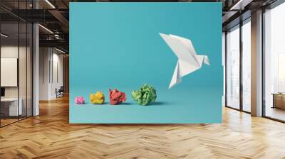 Colorful crumpled paper balls with a paper dove, peace, freedom or opportunities Wall mural