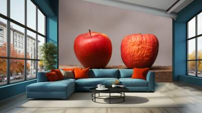 Two red apples on table Wall mural