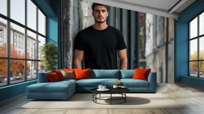 A mockup of a man in a black T-shirt in gothic look
 Wall mural