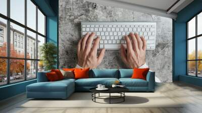 A photo of a person's hands typing on a keyboard, with the person's hands moving very slowly Wall mural