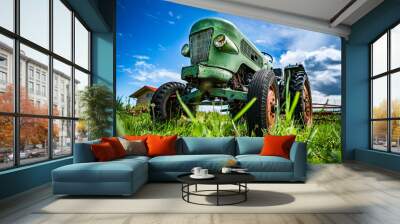 Old tractor in the Alpine meadows Wall mural