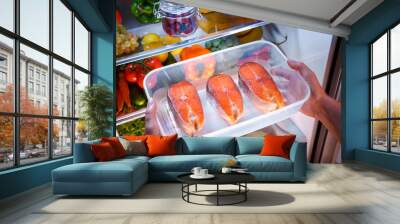 Raw Salmon steak in the open refrigerator Wall mural