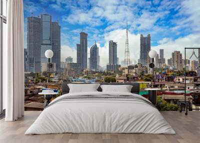 Views of slums on the shores of mumbai, India against the backdrop of skyscrapers under construction Wall mural