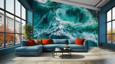 Waves of water of the river and the sea meet each other during high tide and low tide. Wall mural