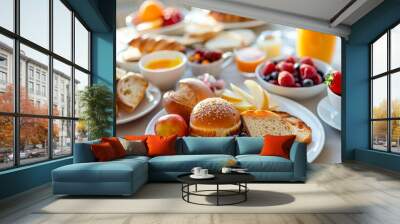 Assorted breakfast foods spread on bright kitchen table for a delicious morning meal Wall mural