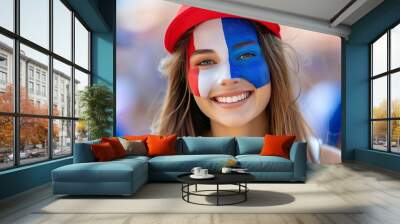 Excited french female fan with painted face, supporting team at stadium with copy space for text Wall mural