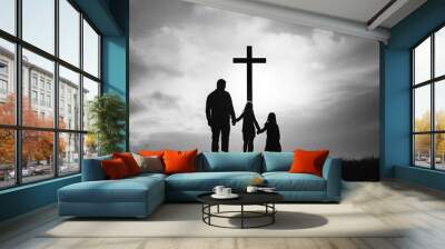 Family looking christian cross silhouette
 Wall mural