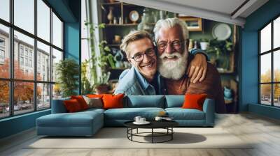 Adult hipster son fun hugging old senior father at home, two generations have a beard talking together and relaxing with smile Wall mural