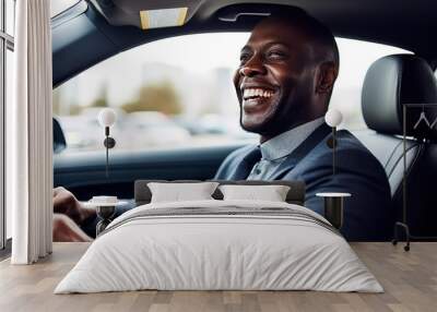 Mid adult man smiling while driving car and looking at mirror for reverse. Happy man feeling comfortable sitting on driver seat in his new car. Smiling mature businessman with seat belt on driving. Wall mural