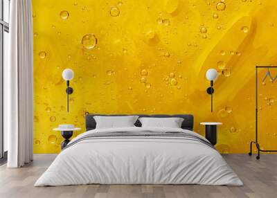 Abstract yellow background with oil drops and waves on water surface Wall mural