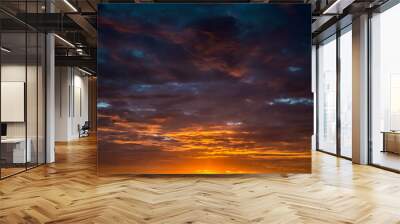 Contract dramatic sky with dark clouds during sunrise Wall mural