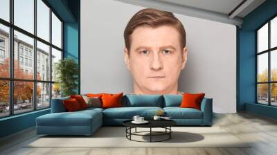 Portrait of blond mature man with neutral calm expression on face Wall mural