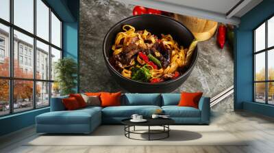 Asian wok with noodle, vegetables and beef Wall mural