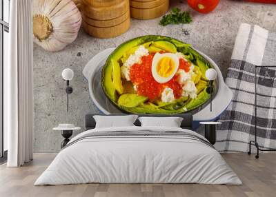 Avocado with red caviar and quil egg Wall mural