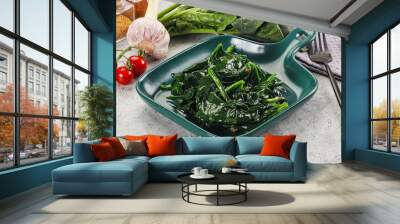 Coocked green spinach with oil Wall mural