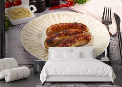 Delicous natural roasted sausages in the plate Wall mural