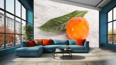 Fresh ripe sweet juicy persimmon Wall mural