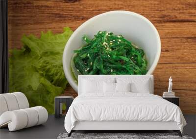 Green Chuka Seaweed Salad Isolated on White Background Top View. Wakame Sea Kelp Salat Wall mural