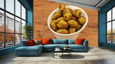 Green grilled olives in the bowl Wall mural