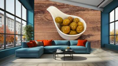 Green pickled olives in the bowl Wall mural