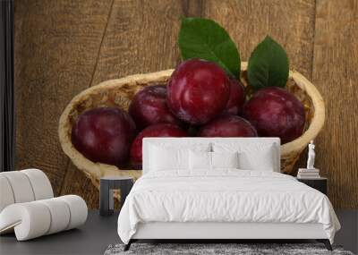 Plum heap in the wooden basket Wall mural