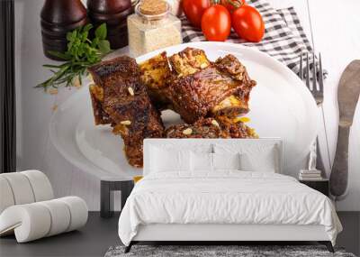 Prepared tasty beef ribs with sauce Wall mural