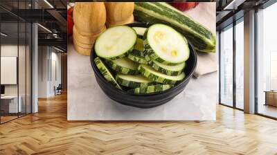 Raw green zucchini slices for cooking Wall mural