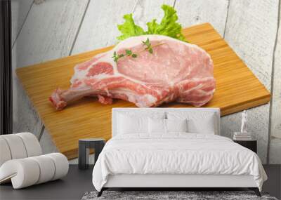 Raw pork bone steak over wooden Wall mural