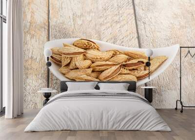 Shelled dry almond nut heap Wall mural