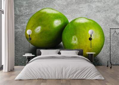 Two ripe green exotic avocado fruit Wall mural