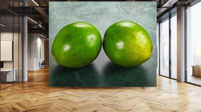 Two ripe green exotic avocado fruit Wall mural