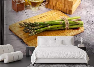 Vegan raw green asparagus heap Wall mural