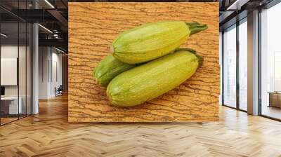 Young tasty zucchini over board Wall mural