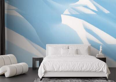 Snow texture. Wind sculpted patterns on snow surface. Wind in the tundra and in the mountains on the surface of the snow sculpts patterns and ridges (sastrugi). Arctic, Polar region. Winter background Wall mural