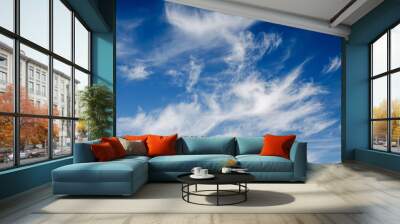 Beautiful fluffy clouds against the blue sky Wall mural