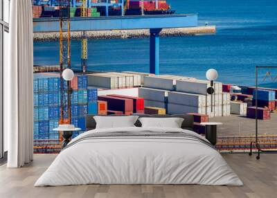 Stacked cargo containers in storage area of freight sea port Wall mural