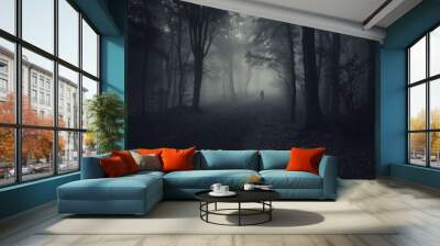 dark forest with spooky man walking on a path Wall mural