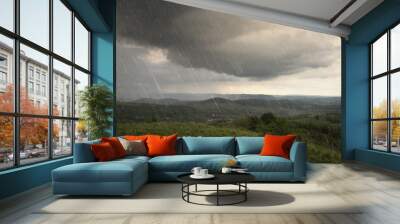 landscape with rain and dramatic clouds over hills Wall mural