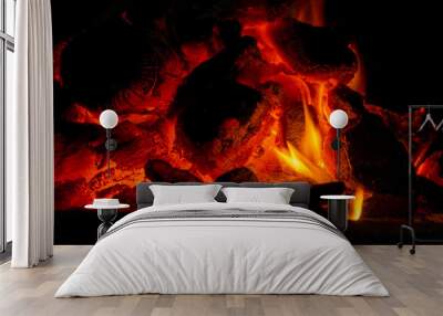 Incandescent charcoal ember in orange and yellow tones Wall mural