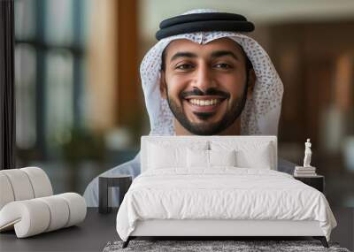 Arabic businessman smiling in modern office building Wall mural