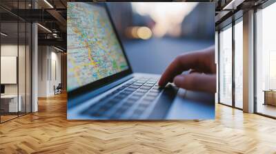 Businessman searching for location using gps on laptop with city map outdoors Wall mural