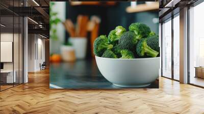 Freshly washed broccoli sitting in bowl on kitchen countertop Wall mural