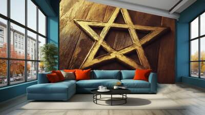 Golden pentacle resting on rustic wooden surface Wall mural