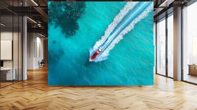 Luxury motorboat speeding on turquoise water leaving white trail Wall mural