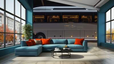 Modern coach bus parked inside building at night Wall mural