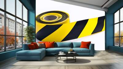 Roll of yellow and black striped caution tape unrolled on white background Wall mural