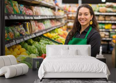 Young smiling woman working in a grocery store produce department Wall mural