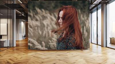 Close up portrait of young ginger sensual pretty caucasian lovely girl with freckled face in autumn field with long hair. Beauty, sexuality, red headed girl, natural beauty, no make up concept Wall mural