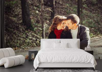 Young happy couple in love hugging outdoors. Tender, romantic, relationships concept Wall mural